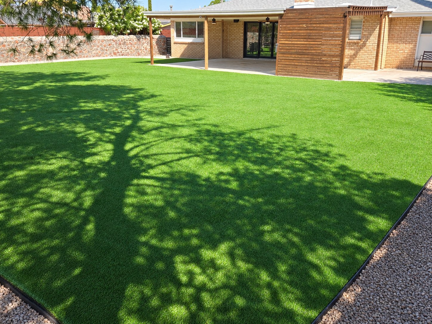 Enhanced view of a completed turf yard beside the home